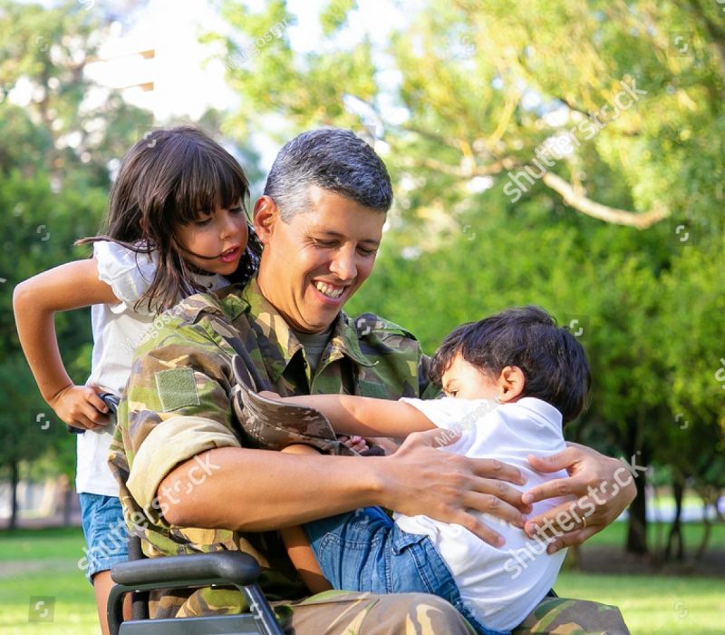 stock-photo-happy-disabled-military-dad-walking-with-two-children-in-park-girl-holding-wheelchair-handles-boy-1847277316